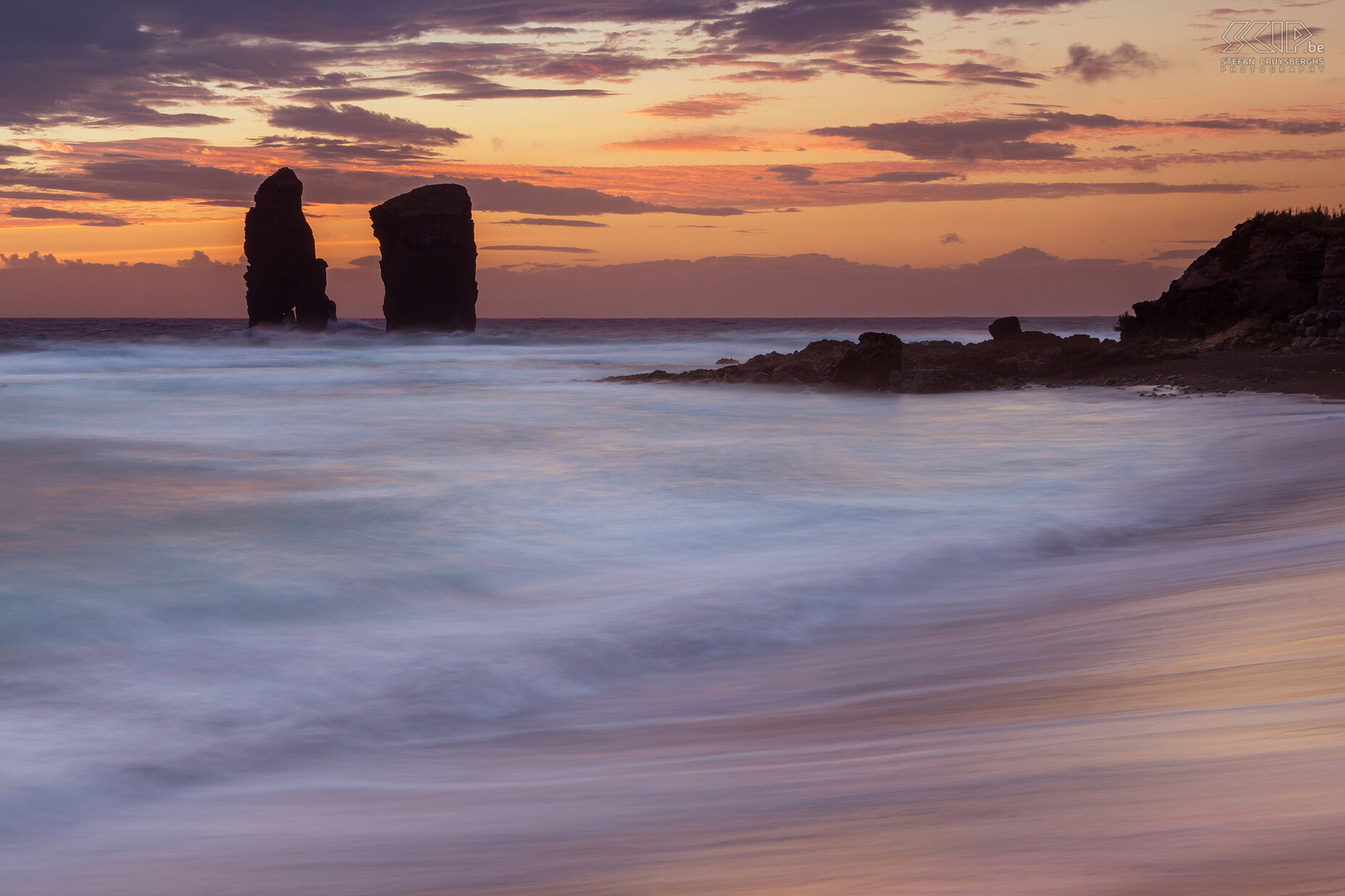 Sunset Mosteiros A beautiful and colorful sunset at the black sandy beach of Mosteiros at the west coast of the island of São Miguel. Stefan Cruysberghs